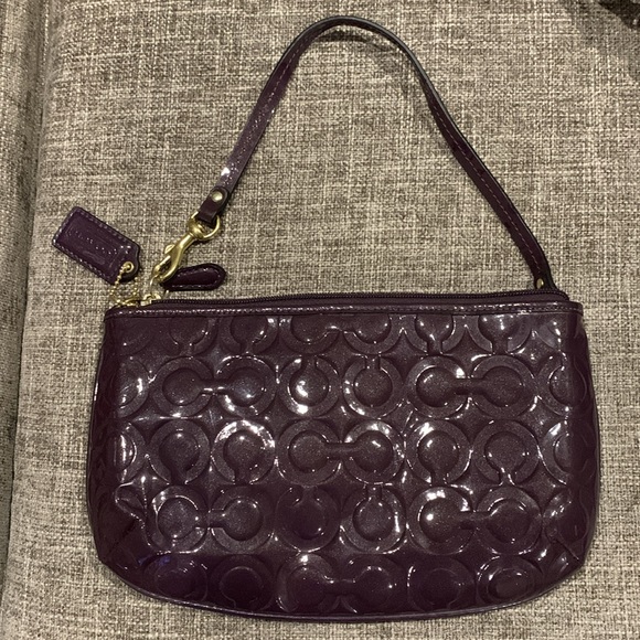 Coach large glossy patent leather wristlet in maroon/purple. Like new - Picture 2 of 4